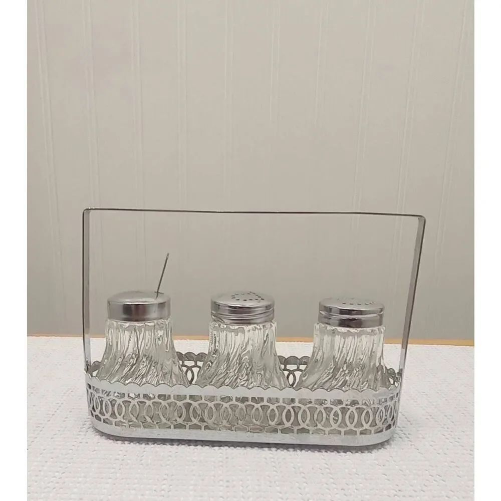 Vintage Crystal like l salt and pepper in silver plated caddy